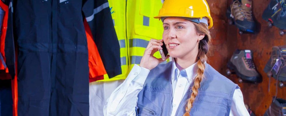 woman-in-gray-vest-with-yellow-hard-hat-inside-room-209719